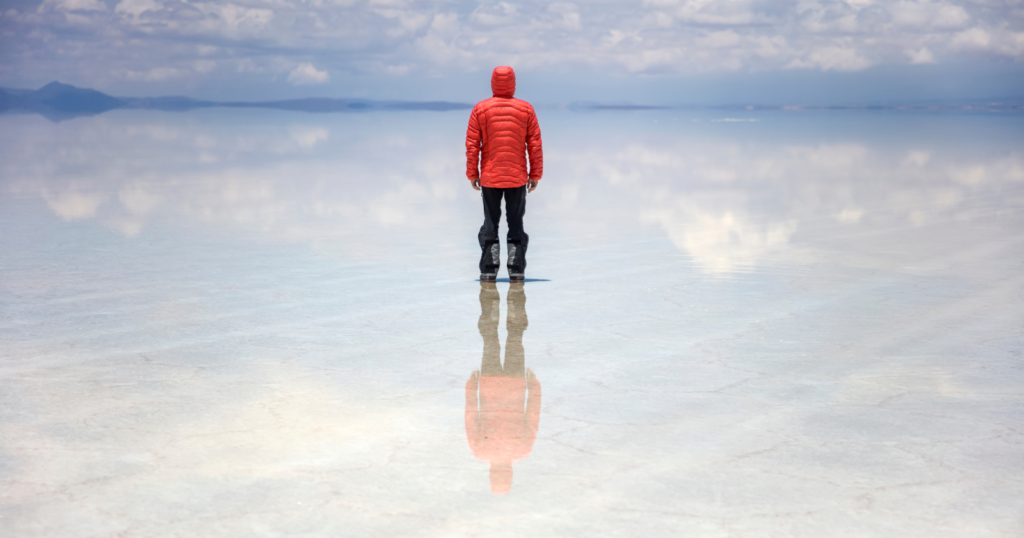 In the middle of the rainy season, a stretch of Bolivia’s high desert turns into the largest mirror on the planet — a thin, perfectly still sheet of water spread across ten thousand square kilometers of salt, so exact that the sky and the ground become impossible to tell apart