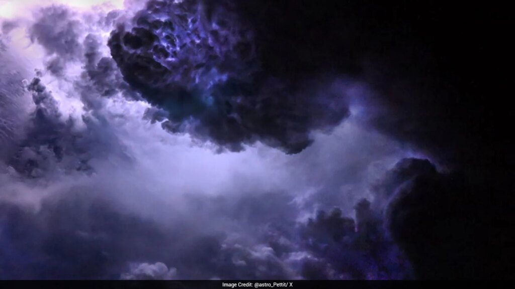 Astronaut Captures Purple Lightning Flashing Through Clouds From International Space Station